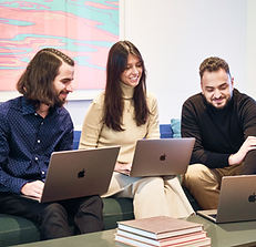 Neuron UX Team collaborating on laptops